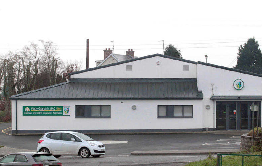 Large detached white building with a slanted roof